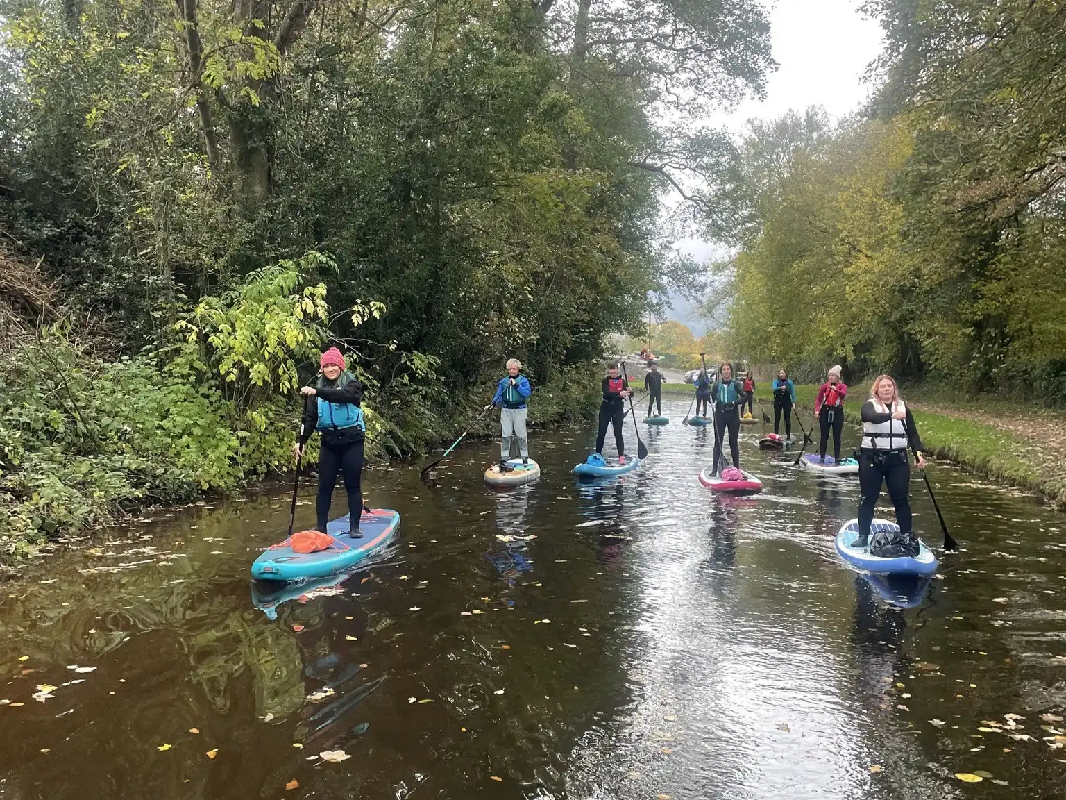 Group of paddleboarders on canal