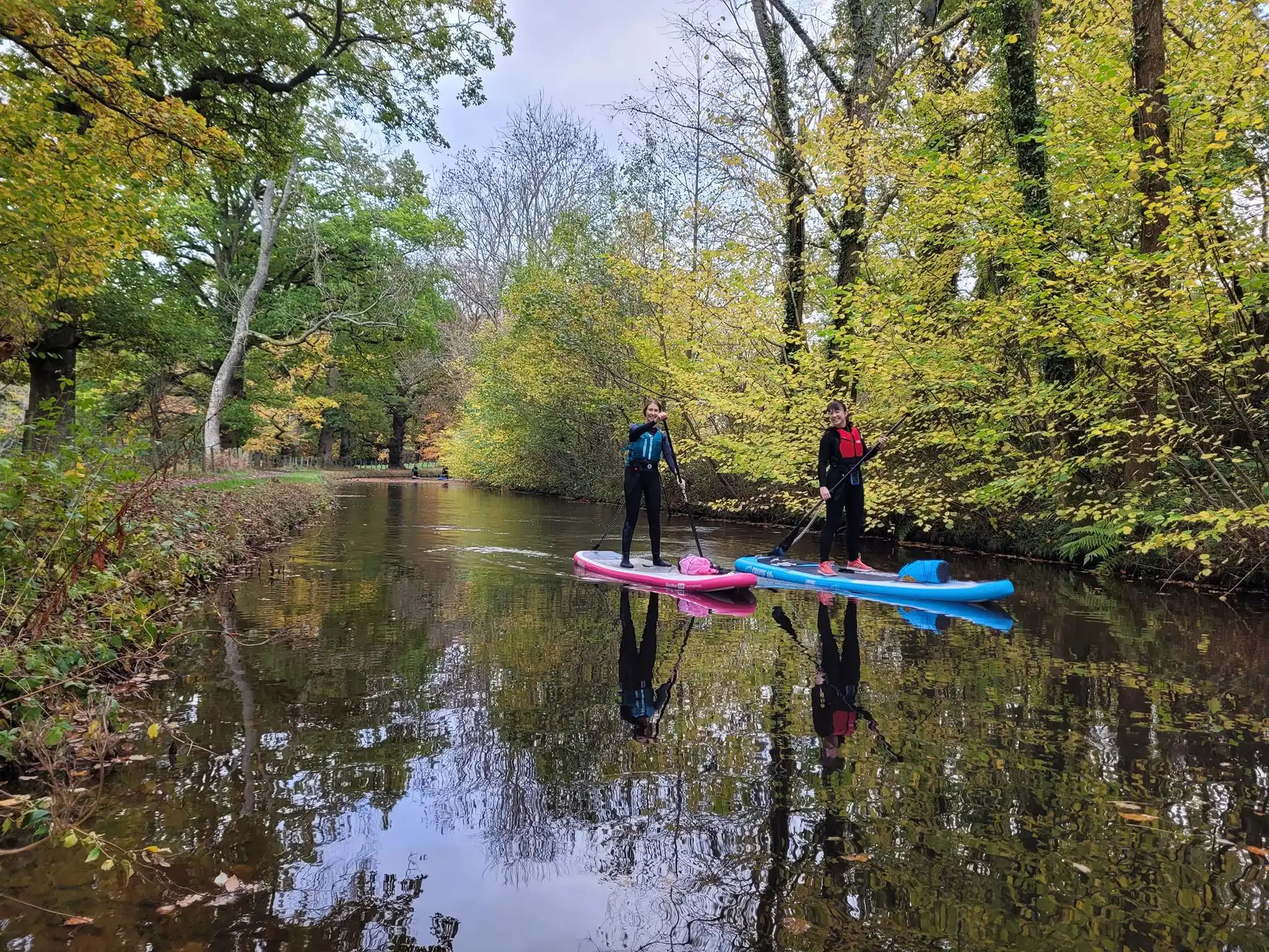 Group of paddleboarders on canal