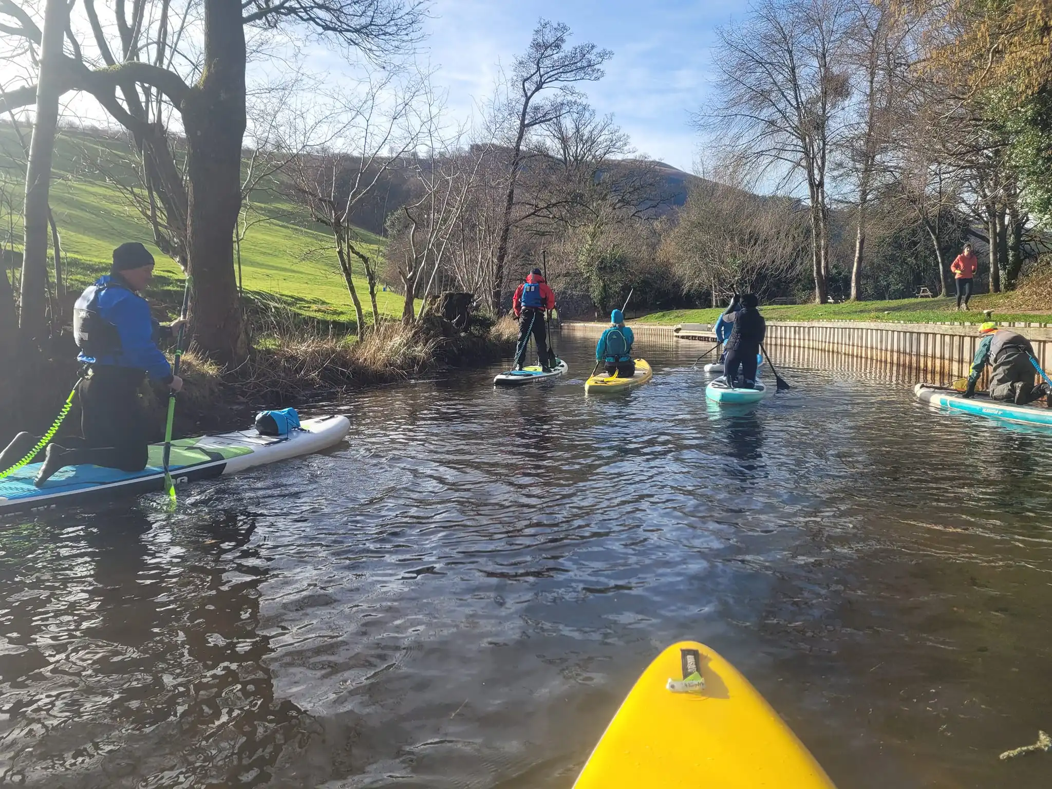 Group of paddleboarders on canal