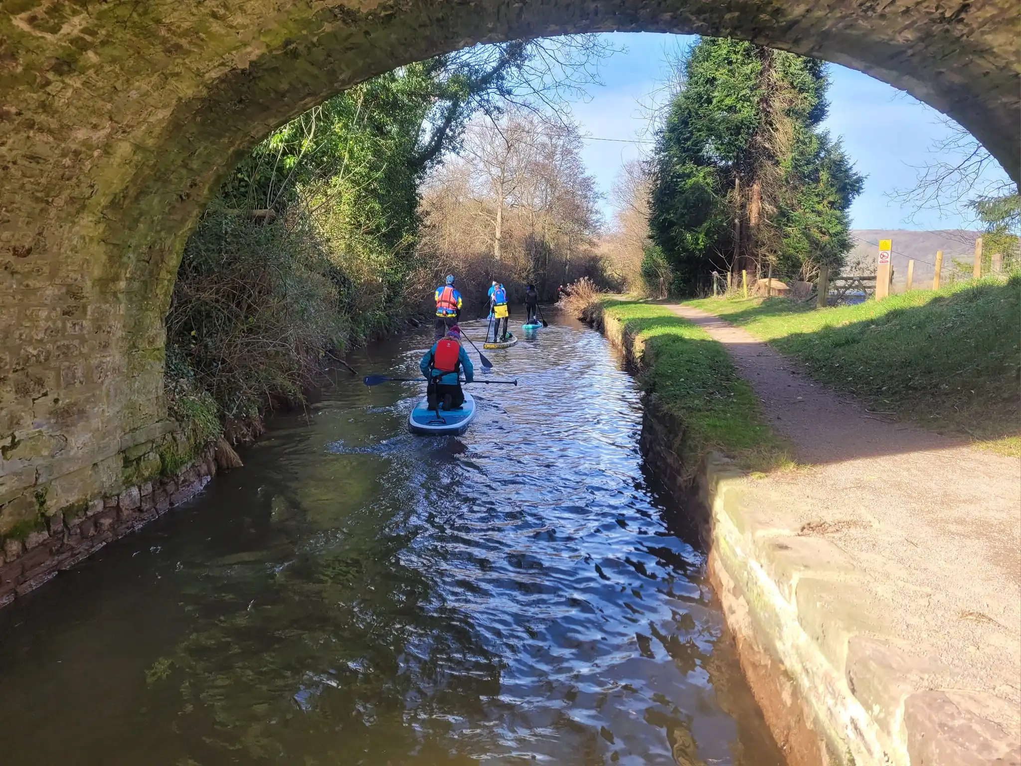 Group of paddleboarders on canal