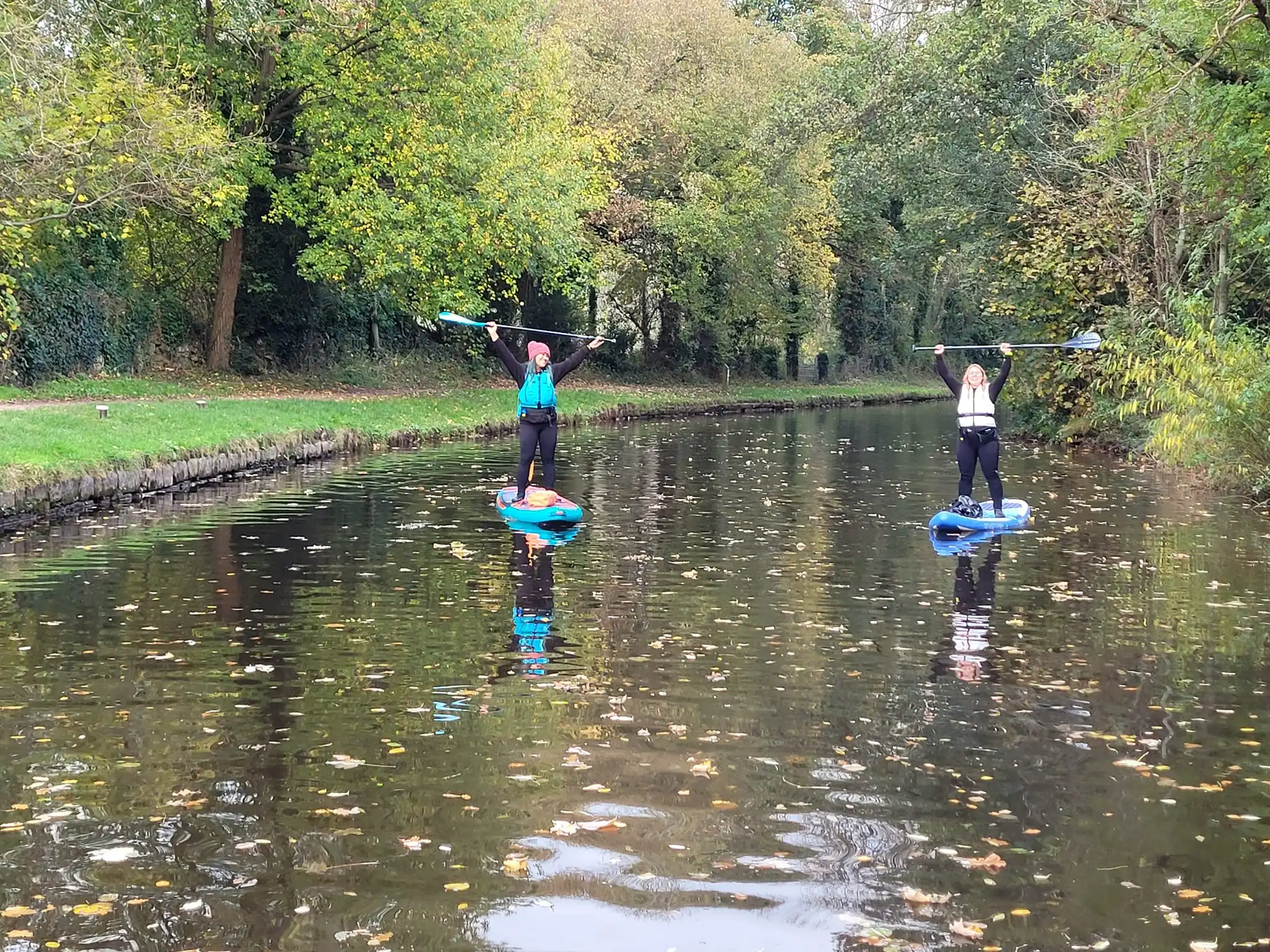 Group of paddleboarders on canal