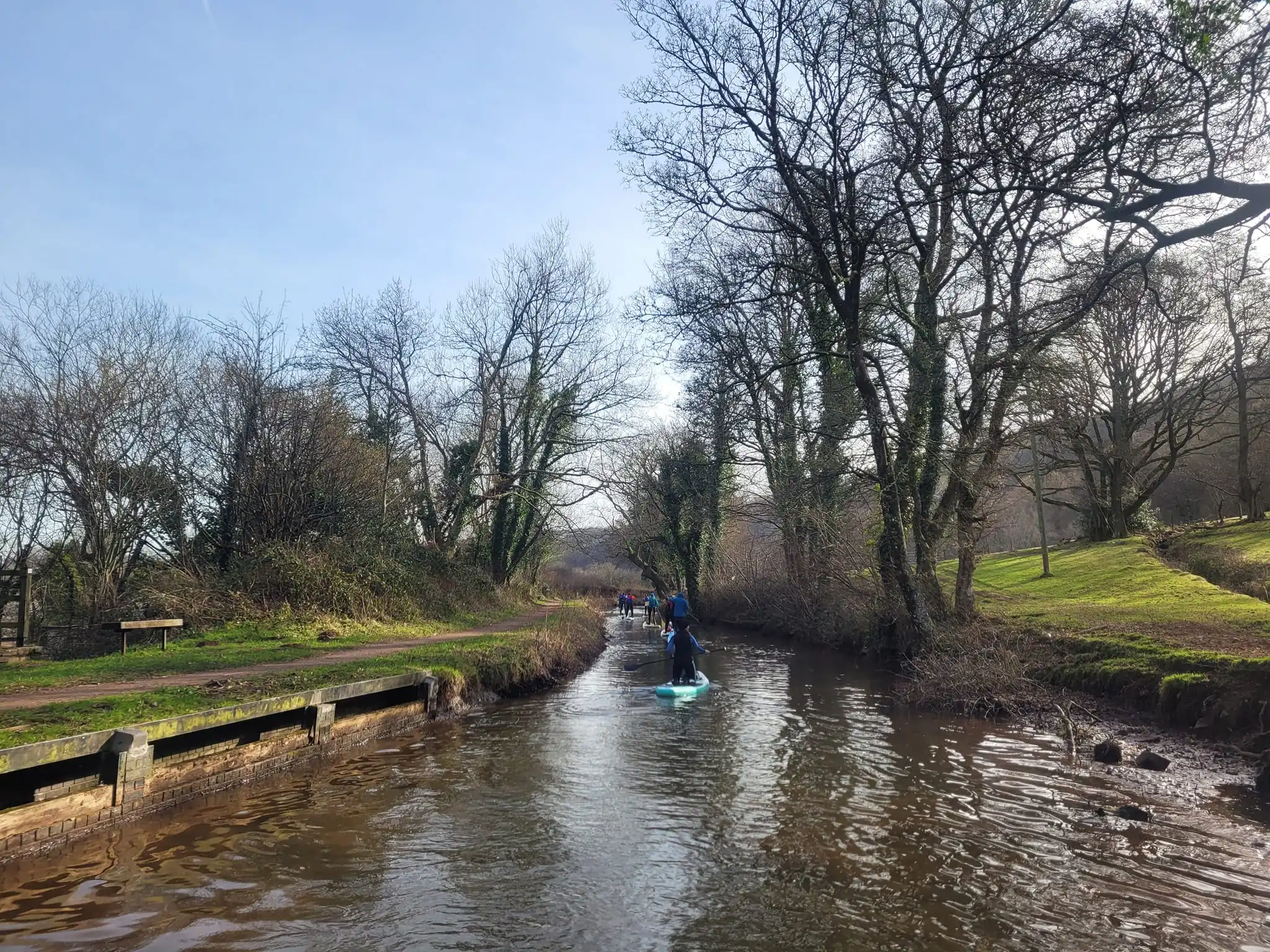 Group of paddleboarders on canal