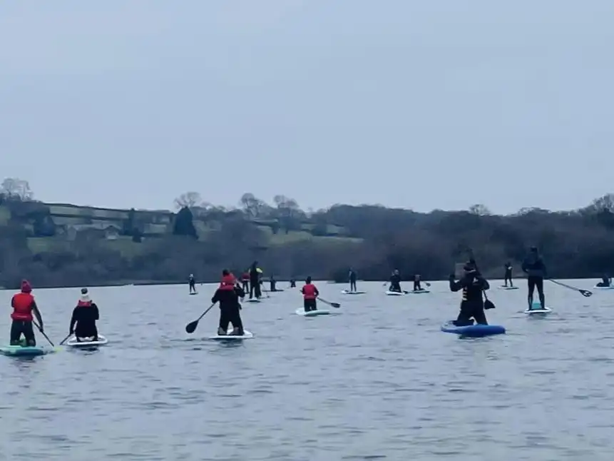 Group of paddleboarders on llandegfedd lake